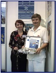 Mrs L.Kotelva and Pascal in front of awarded painting