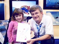 Pascal Lecocq with young drawing contestants at the Paris Dive show 2007, with publishing parents authorization